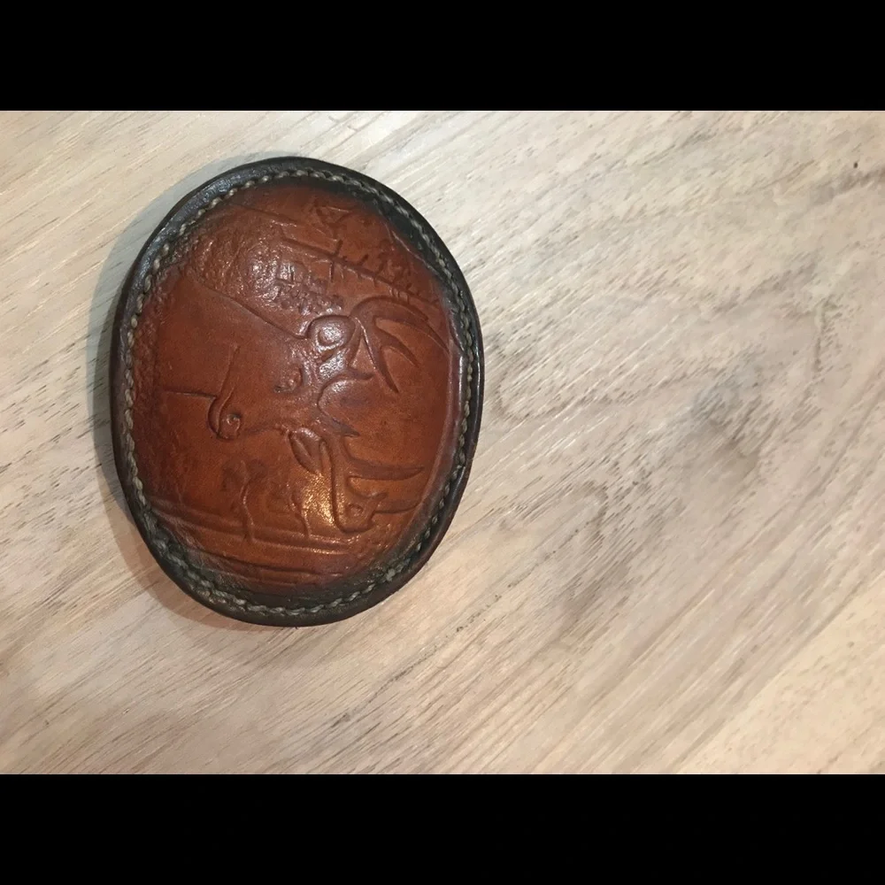 - Handcrafted leather seat belt buckle in brown